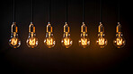 Hanging lightbulbs. Innovation, data connection concept. Teamwork technology development