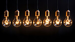 Hanging lightbulbs. Innovation, data connection concept. Teamwork technology development