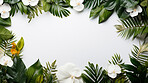 A frame of tropical leaves around a white empty space. Copy space concept.