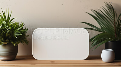 Tropical leaves around a white empty space on table. Copy space concept.