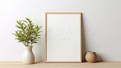 Canvas mockup against white wall. Empty canvas on table top for your design.