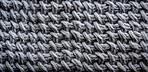 Close-up of grey texture fabric. Wool textile background.