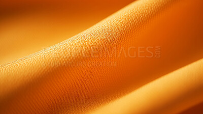 Close-up of folded, yellow texture fabric cloth textile background.