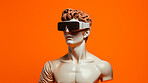 Sculpture or statue of David wearing a VR headset on an orange background