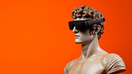 Sculpture or statue of David wearing a VR headset on an orange background