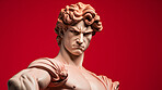 Sculpture or statue of David with angry or annoyed expression on red background