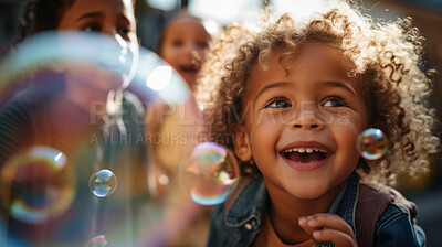 Group of diverse kids with bubbles. Exciting outdoor weekend fun activity