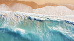 Aerial drone view of tropical shoreline and waves, clean turquoise beach