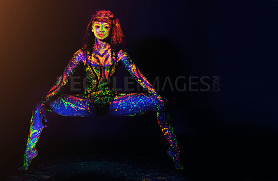 Buy stock photo Full length portrait of a young woman posing with neon paint on her face