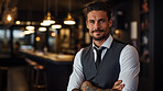 Professional man posing in restaurant. Tattooed arms. Alternative lifestyle concept.