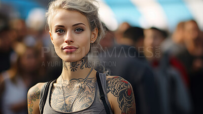 Portrait of attractive tattooed model in street. Alternative lifestyle concept.