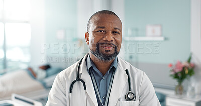Healthcare, doctor and black man with arms crossed at hospital with smile for support, service and wellness. Medicine, professional and African expert with happiness and pride for career or surgery