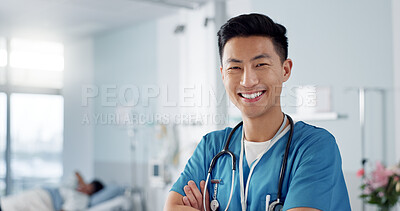 Medicine, doctor and asian man with arms crossed at hospital with smile for support, service and wellness. Healthcare, professional or expert with happiness and pride for career, surgery or insurance