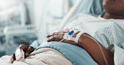 Patient hand, bed and drip in closeup, hospital or treatment for hydration, liquid or supplement. Person, healthcare and wellness with blood transfusion, anesthesia or pharma drugs for pain in clinic