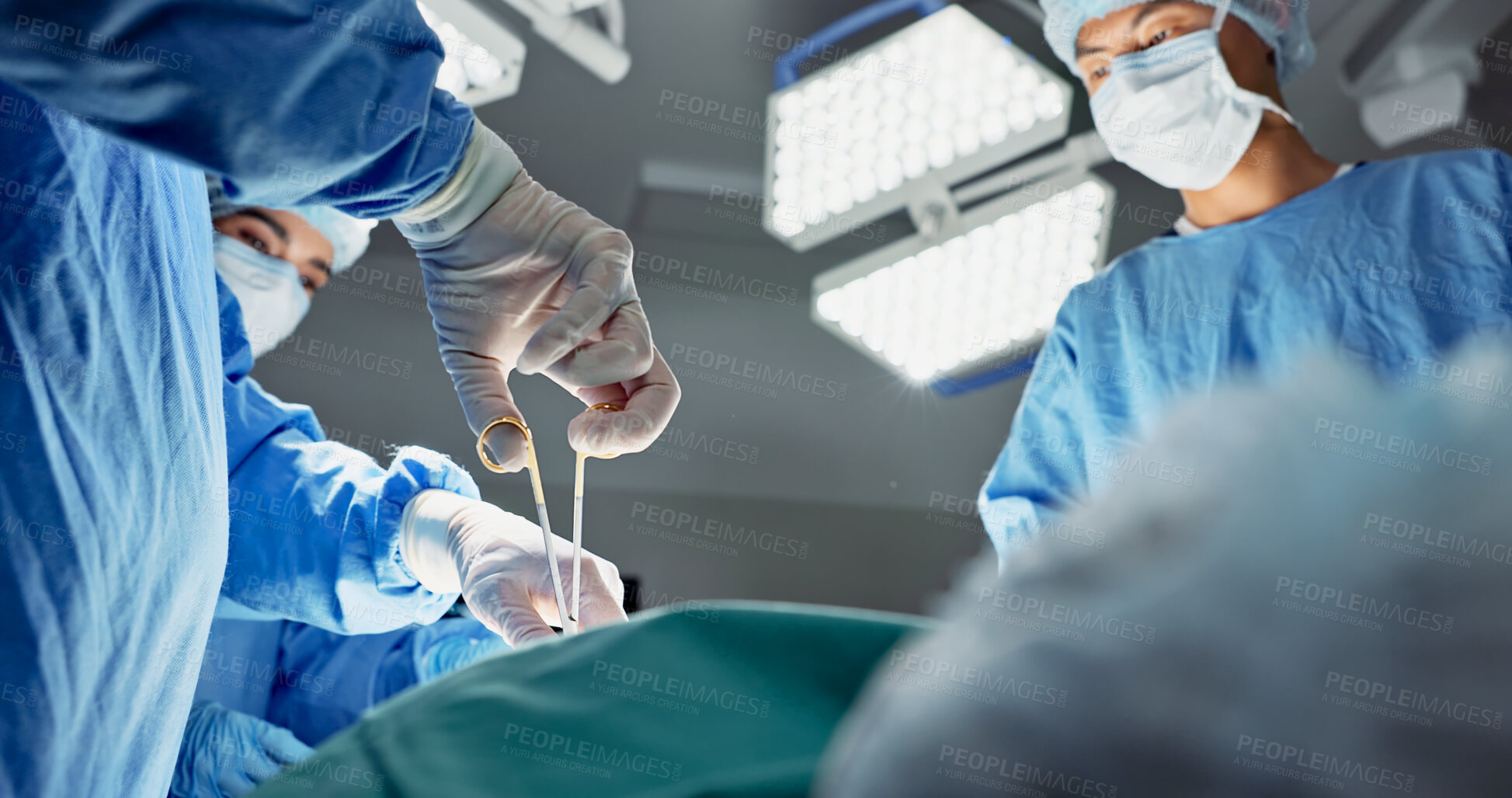 Buy stock photo Doctors, team and scissors in theater for surgery, healthcare or medical support and operation room at hospital. Surgeon, medicine and teamwork or collaboration with tools for cardiology or emergency