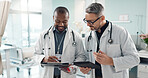 Doctors, men and tablet for team discussion, planning and advice with innovation, research or problem solving. Diversity, medical partnership and talk with notebook, digital touchscreen and report