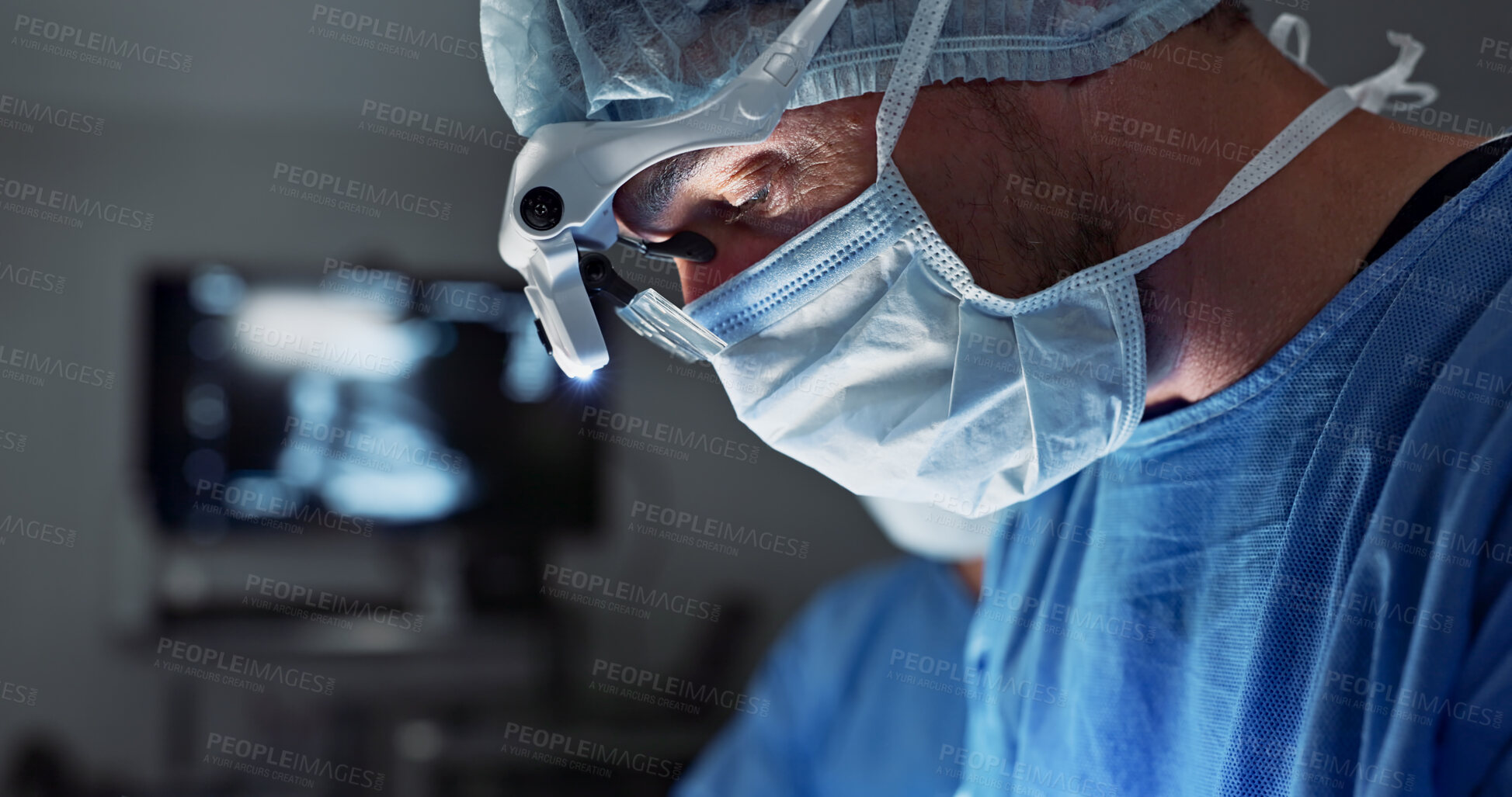 Buy stock photo Surgery, hospital and doctor with face mask for operation, medical emergency and service in theater. Healthcare, procedure and closeup of surgeon with light for patient injury, wellness and accident