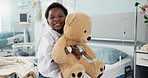 African boy child, hospital and teddy bear on bed with face, smile and rest for recovery for healthcare treatment. Patient kid, happy and portrait to relax, clinic and hug with toys after surgery