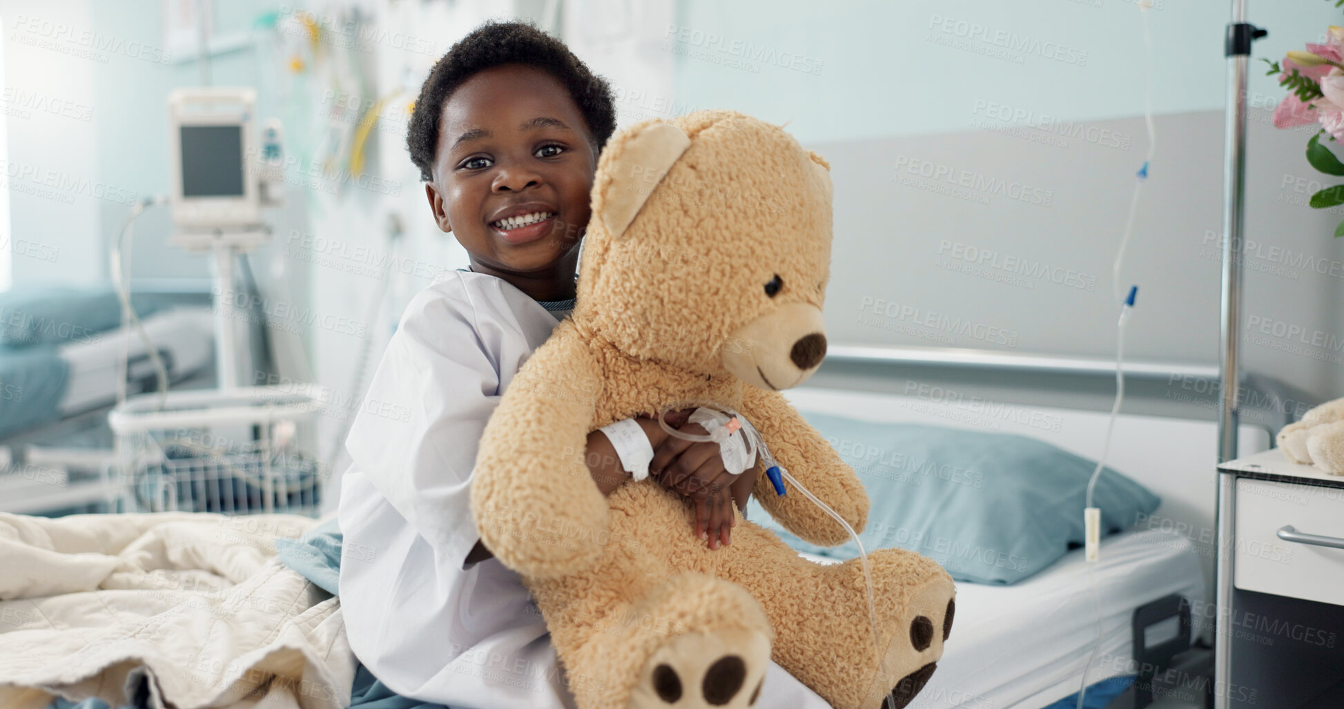 Buy stock photo African boy child, hospital and teddy bear on bed with face, smile and rest for recovery for healthcare treatment. Patient kid, happy and portrait to relax, clinic and hug with toys after surgery