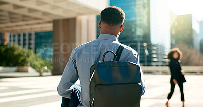 City, back and business person walking on outdoor urban journey, commute and businessman on way to office building. Backpack, morning and professional agent on morning travel to work in Chicago, USA