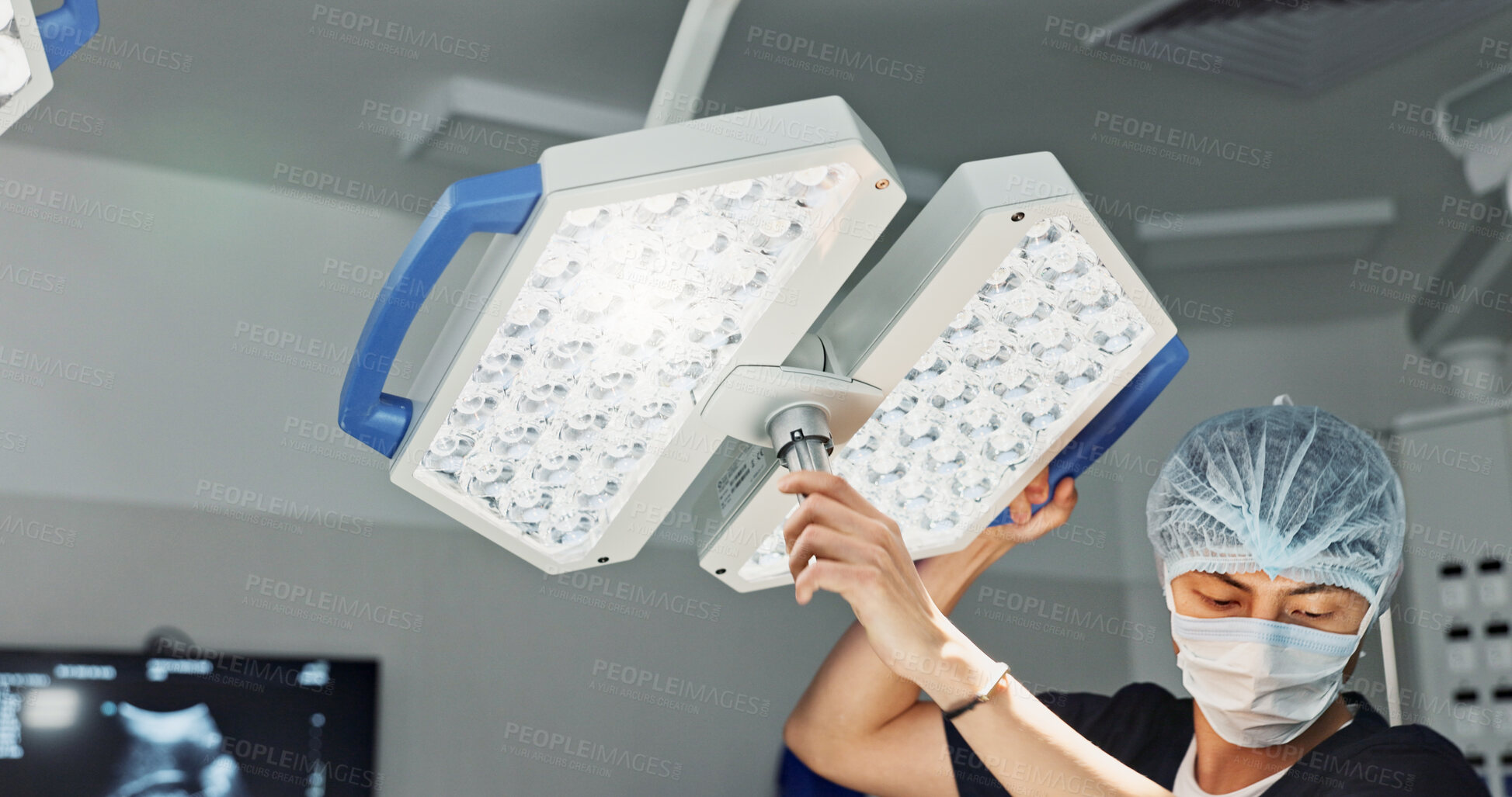 Buy stock photo Assistant, surgery and nurse with surgical light for medical emergency treatment in the hospital ER or clinic. Professional, healthcare and worker doing operation, transplant and with medicine tools