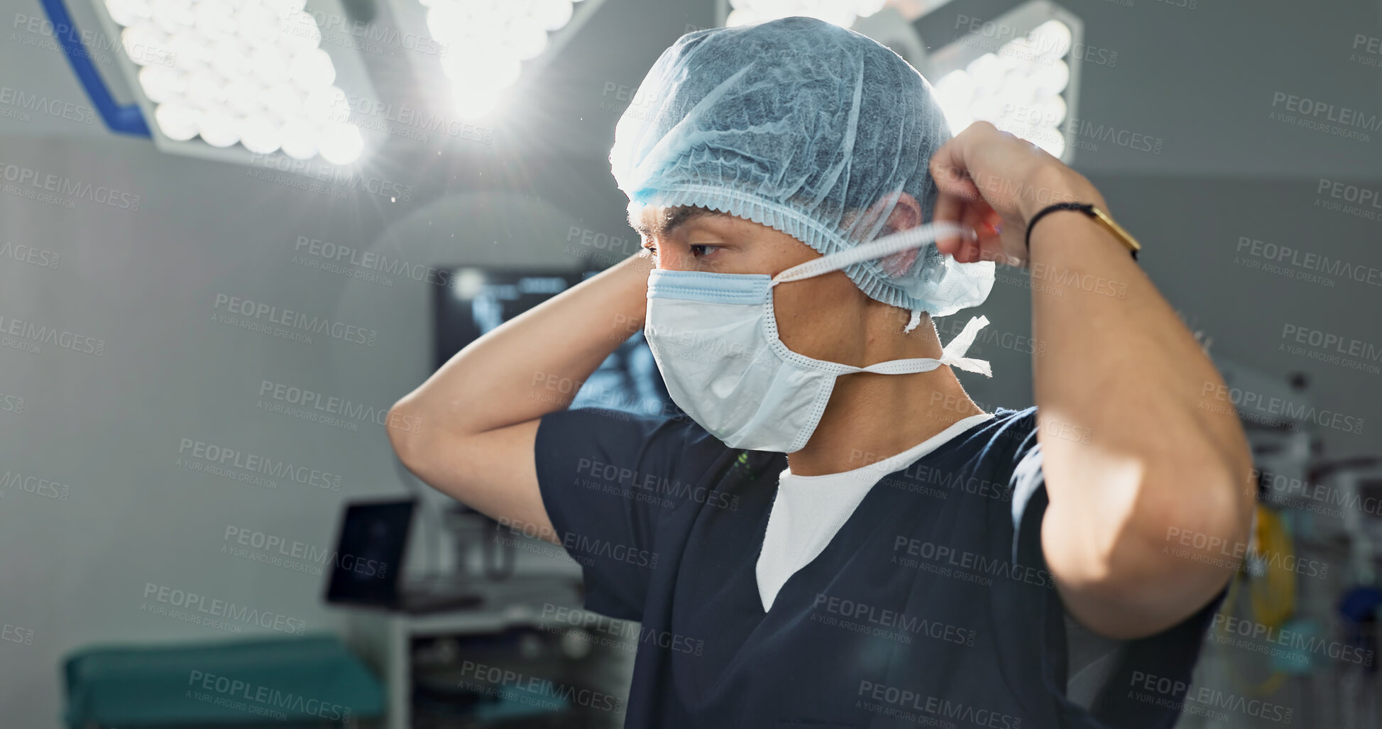 Buy stock photo Surgery, doctor and man with face mask in hospital theatre for medical service, preparation and operation. Healthcare, safety scrubs and person with uniform for emergency, procedure and protection