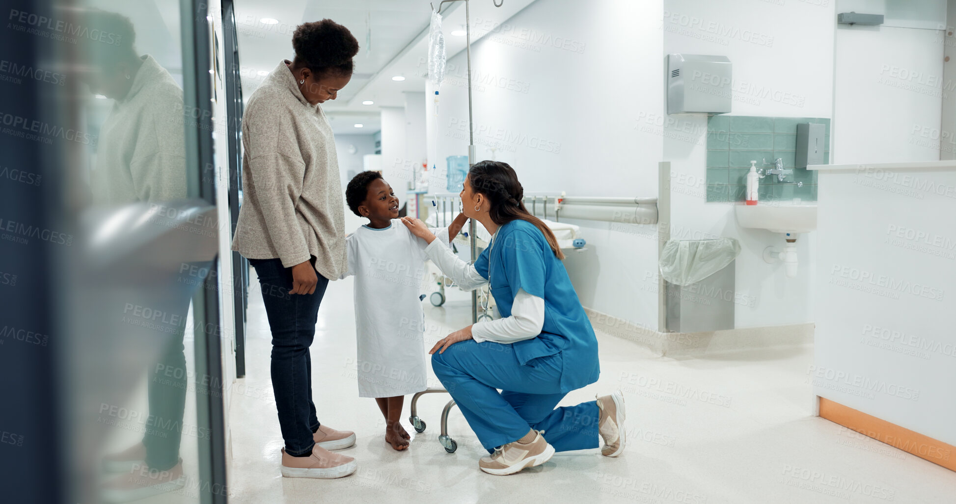 Buy stock photo Black family, healthcare and a pediatrician talking to a patient in the hospital for medical child care. Kids, trust or medicine and a nurse consulting a boy with his mother in the clinic for health