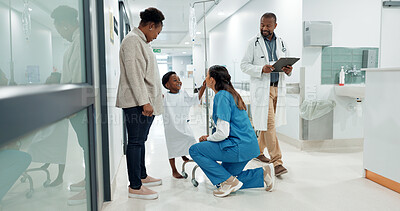 Black family, medicine and a pediatrician talking to a patient in the hospital for medical child care. Kids, trust or healthcare and a nurse consulting a boy with his mother in the clinic for health