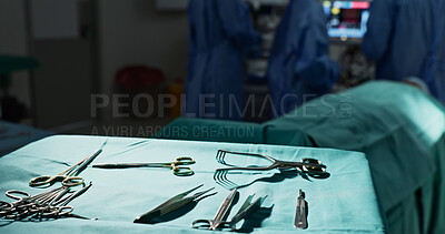 Surgery, health and tools in operation theatre, help in medicine with treatment and closeup of equipment on table. Metal, medical and surgical instrument with doctor people at hospital for healthcare