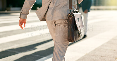 Buy stock photo Businessman, walk and city street closeup or morning work commute, briefcase or professional. Male person, legs or corporate employee fashion or suit leather bag, public travel for career on sidewalk
