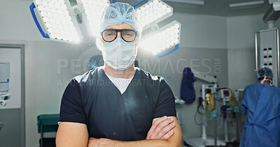Surgeon, doctor and man in portrait with arms crossed, healthcare and confidence in operation theater for medical procedure. Surgery, health professional and help in hospital, expert with face mask
