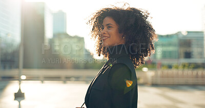 Business, black woman and walking outdoor in city building with thinking and smile for morning travel or journey outdoor. Happy, person with afro and corporate worker moving to work in urban town