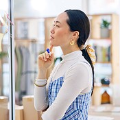 Thinking, brainstorming board and Asian woman, designer and retail ...