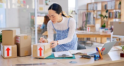 Ecommerce, Asian woman with checklist and boxes at laptop, reading sales or inventory at fashion startup. Online shopping, delivery and small business owner, stock list for web shop package checking.