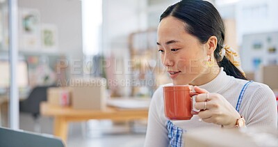 Ecommerce, Asian woman at laptop with coffee and boxes, checking sales email or work at fashion startup. Online shopping, distribution and small business owner with drink, computer and review at desk