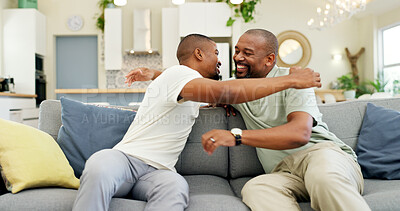 Hug, talking and a father and son on the sofa for a visit, bonding or gratitude. Happy, house and an African dad embracing an adult man for greeting, love or care during a conversation on the couch