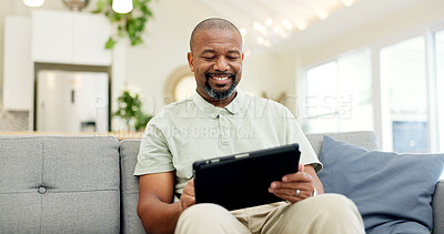 Technology, mature man with tablet and in living room of his home happy for social media. Online communication or networking, connectivity or leisure and black male person on couch with smile