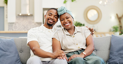 Black couple, love and relax on a home sofa for happiness, bond and care in a living room. Face of an African woman and man together for affection, portrait and hug or comfort in a happy marriage