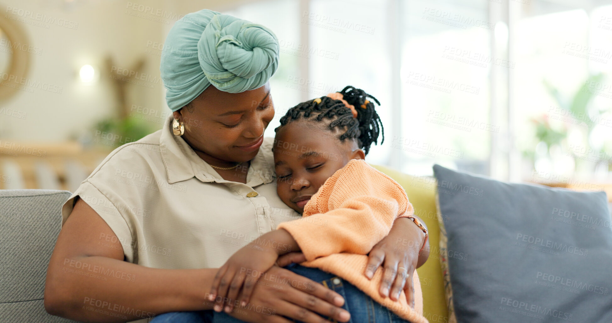 Buy stock photo Mother hug sleeping child on couch for love, care or holding for comfort in lounge at home. Black woman, happy mom and kissing girl kid on lap for nap, rest or support to relax on sofa in living room