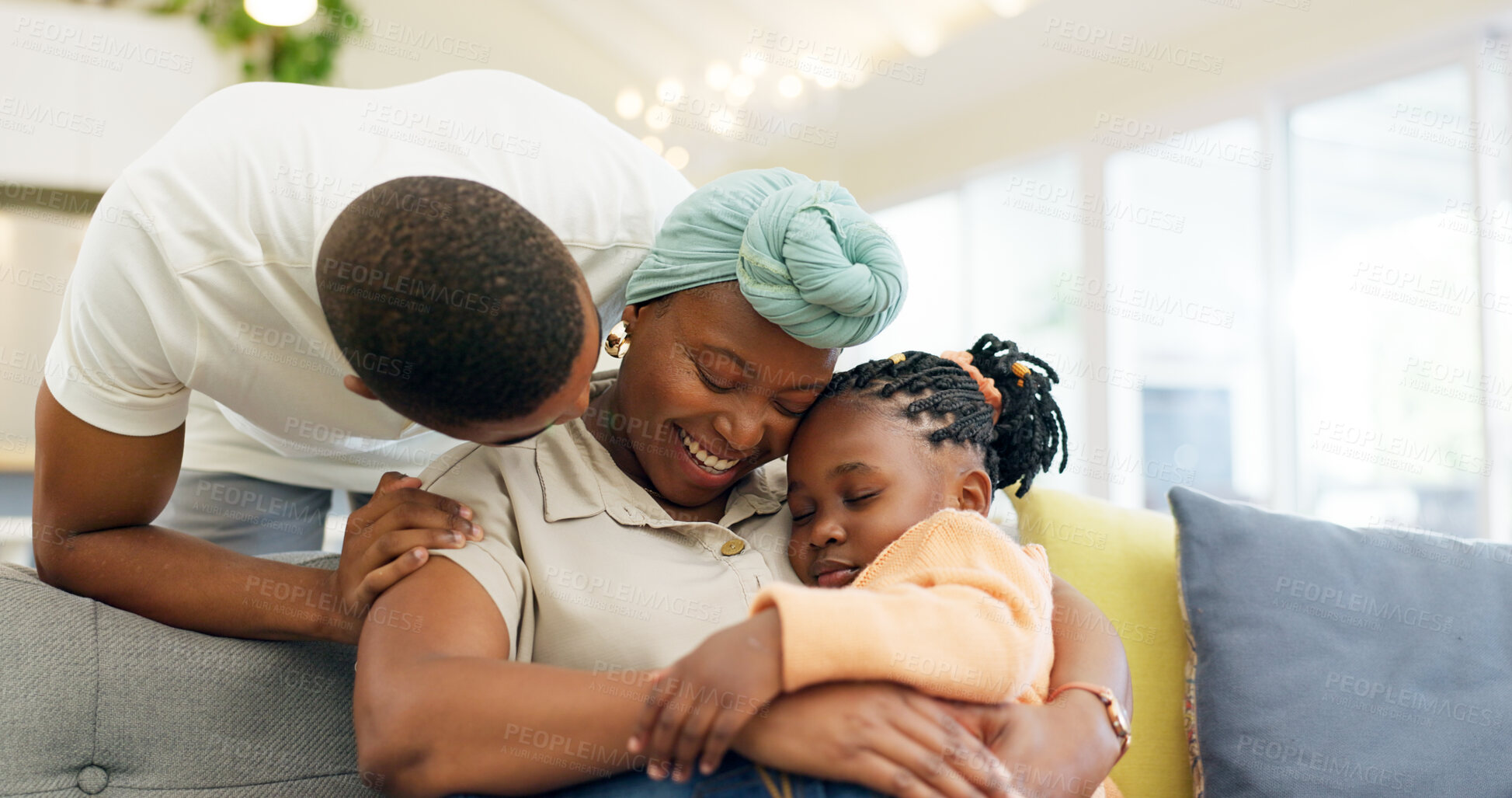 Buy stock photo Black family, relax and parents hug child on sofa at home for bonding, quality time and happiness. Love, lounge and happy mother, father and girl on couch embrace together for care in living room