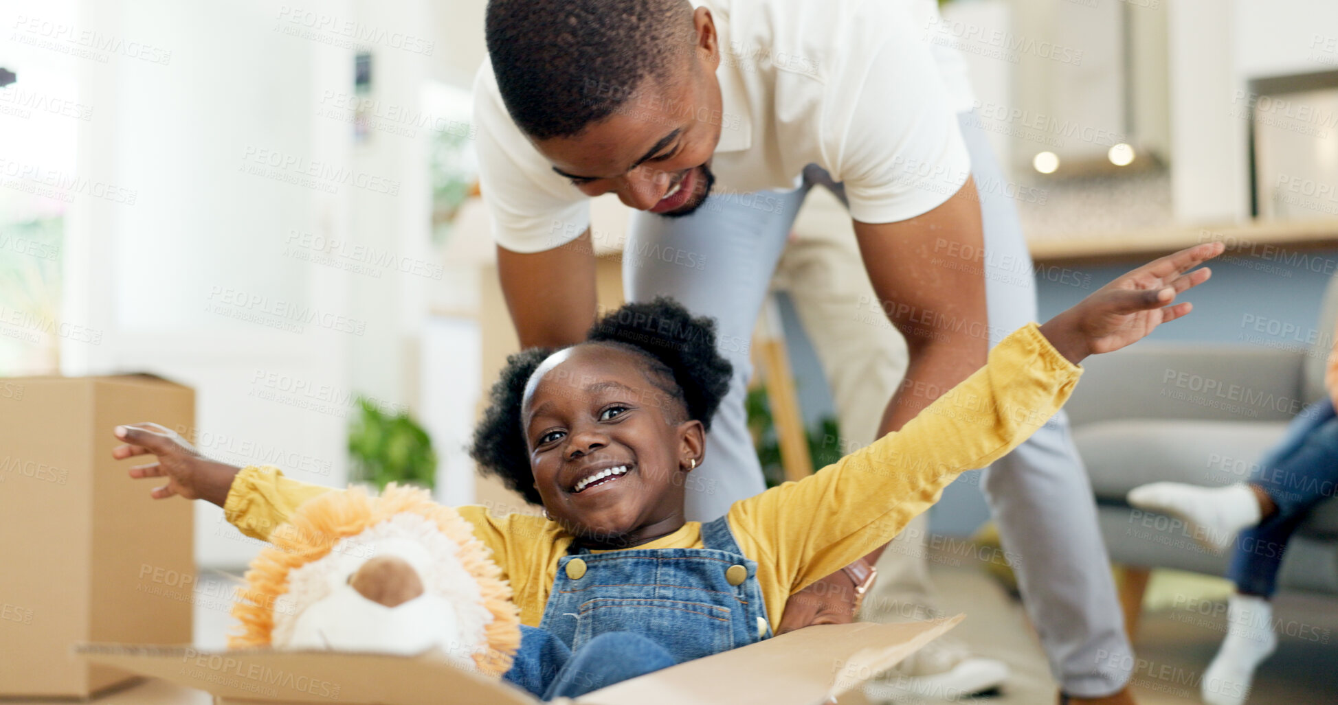 Buy stock photo Father, playing and child in a box while moving house with a black family together in a living room. Man and a girl kid excited about fun game in their new home with a smile, happiness and energy