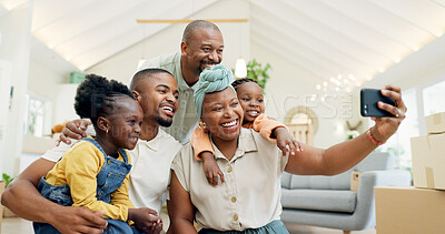 Moving, happy family and selfie with kids in new home, boxes and people in living room of house. African mother, father and children in self portrait with boxes, real estate and happy investment.