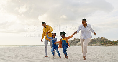 Happy, travel and holding hands with black family at beach for summer, vacation and relax. Holiday, support and love with parents and children walking on coastline for care, trust and freedom