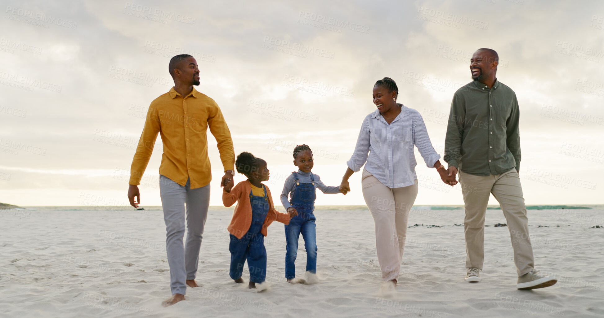 Buy stock photo Love, travel and holding hands with black family at beach for summer, vacation and relax. Holiday, support and happy with parents and children walking on coastline for care, trust and freedom