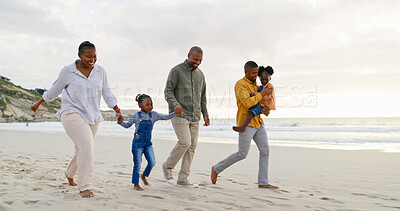 Happy, walking and a black family at the beach, holding hands and talking on a holiday. Sunset, conversation and grandparents, father and children on a walk by the sea during a vacation for travel
