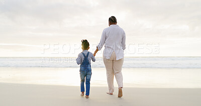 Black family, mother and daughter holding hands, beach and bonding with love and care, back view and walk outdoor. Sea, freedom and travel, woman and girl on holiday with trust and support in nature