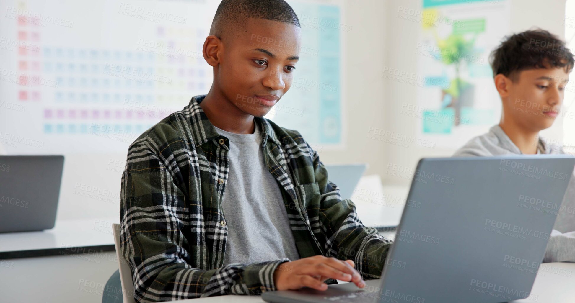 Buy stock photo Teenager child, laptop and education at school with research, coding or computer science. Black kid in classroom with technology for learning, problem solving and system or software study at academy