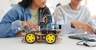 Robotics, education and hands of children at school learning about coding, robot or car toy in class. Kids in classroom for technology, electronics or science for development, innovation and teamwork