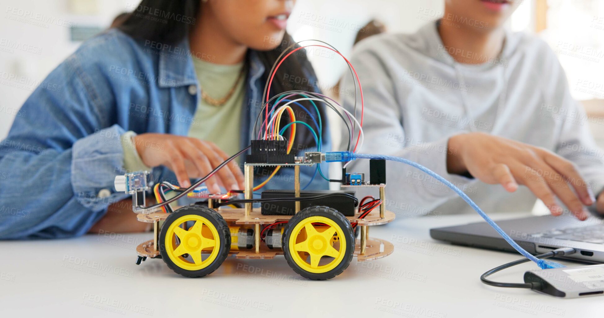 Buy stock photo Robotics, education and hands of children at school learning about coding, robot or car toy in class. Kids in classroom for technology, electronics or science for development, innovation and teamwork