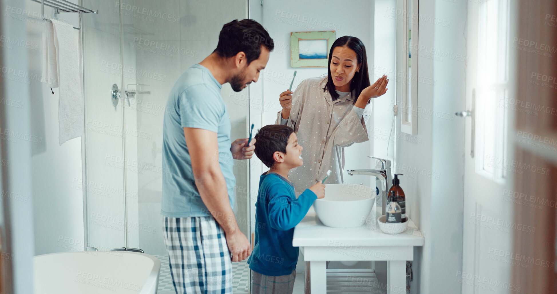 Buy stock photo Parents, child and brushing teeth in family home bathroom while learning or teaching dental hygiene. A woman, man and kid with toothbrush and toothpaste for health, cleaning mouth and wellness